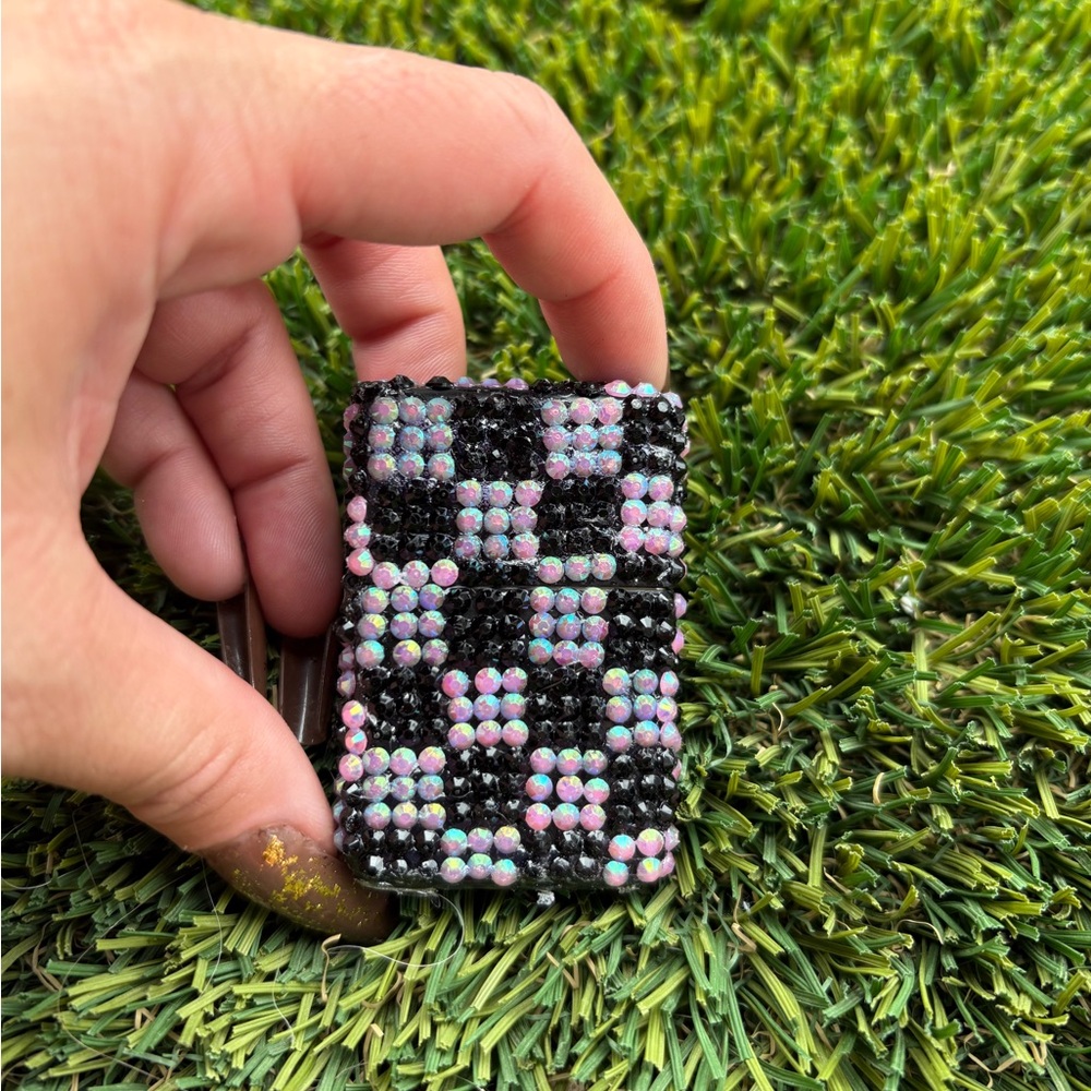 Pink and black checkered zippo